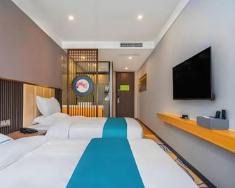 Tuker Shanglin Hotel (Zibo Huantai Jinjing Avenue Industrial Vocational College Branch) - Zibo - Bedroom