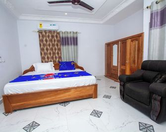 Yaa Asantewaa Inn - 庫馬西 - 臥室