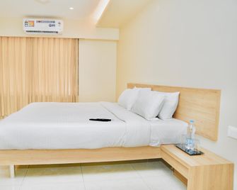 Hotel Shri Ram Residency - Belgaum - Schlafzimmer