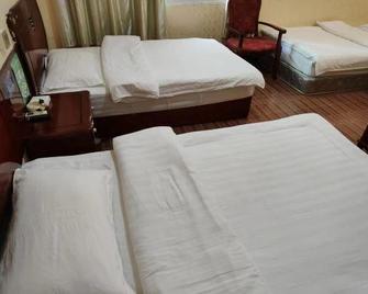 Dongnan Hotel - 시솽반나 다이족 자치주 - 침실