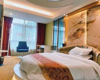 Elan Hotel Jishou Railway Station - Xiangxi - Bedroom