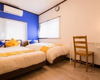 Universal Vacation Home - Ōsaka - Schlafzimmer