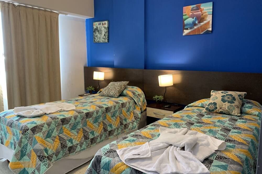 أجنحة نوفوم - قرطبة - غرفة نوم