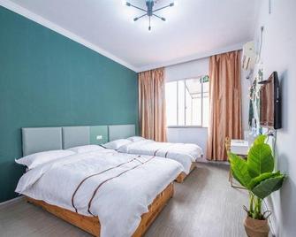 Kaili Haolaiwu Hotel - Qiandongnan - Bedroom
