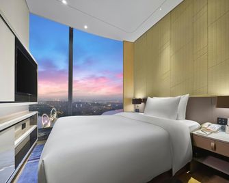International Youth Convention Hotel - Nanjing - Schlafzimmer