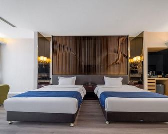 Qingdao Jinfuyue Hotel (Heilongjiang Middle Road Oriental City Branch) - Qingdao - Bedroom