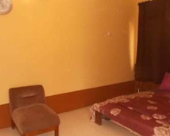 Huwuaji Apartments - Magbon - Habitación