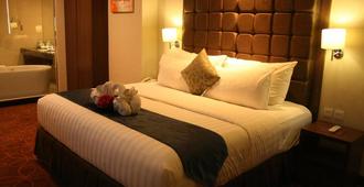 MG セトス ホテル スマラン - スマラン - 寝室