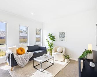 Well-decorated 4BR Family home steps to mall - Browns Plains - Living room