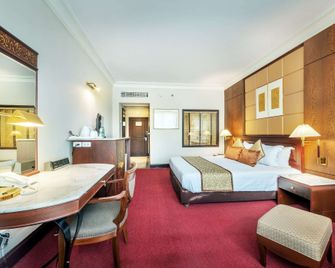 Ramada by Wyndham Bangkok Chaophya Park - בנגקוק - חדר שינה