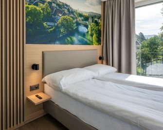 stay flex Hotel & Apartment - Obersiggenthal - Спальня