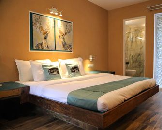 Tiger N Woods Resort - Khawāsa - Bedroom
