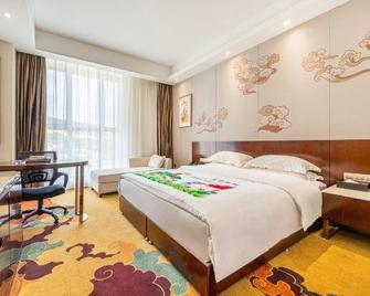 Yan'an Yanfei Libin Hotel - Yan’an - Bedroom