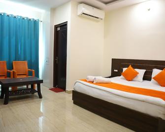Hotel Krishna Inn - Pachmarhi - Slaapkamer