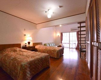 Petit Hotel Key West Club - Onna - Habitación