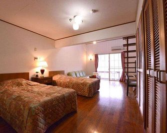 Petit Hotel Key West Club - אונה - חדר שינה