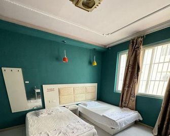 Wuhan Huda Apartment Apartment (Hubei University Branch) - Wuhan - Bedroom
