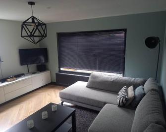 Vakantiechalet Tip 30 op vakantiepark de Heische Tip - Zeeland - Wohnzimmer