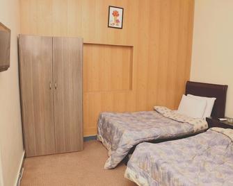 Swiss Cottage Hotel - Islamabad - Ložnice