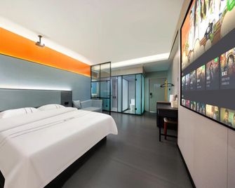 Next Wisdom Hotel - Wanning - Bedroom