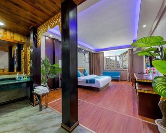 Xishuangbanna Peacock Princess Hotel - Xishuangbanna - Schlafzimmer