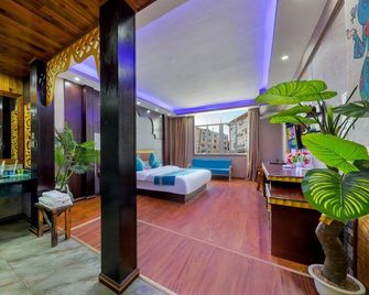 Xishuangbanna Peacock Princess Hotel - Xishuangbanna - Bedroom