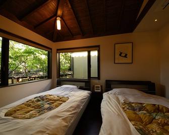 Yufuin Onsen Ryokan Mebaeso - יופו - חדר שינה