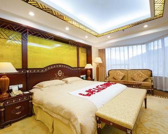 Manwan Hotel - Dali - Yatak Odası