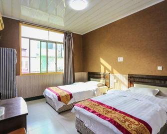 Xinyijia Hotel - Chengdu - Schlafzimmer