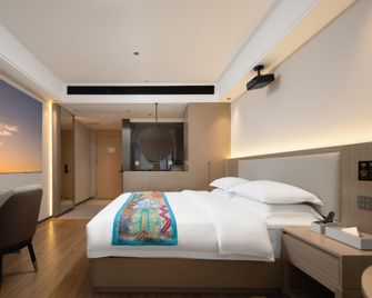 Xinglong Nanyang Hotel (Nanyang Flavor Main Store) - Wanning - Ložnice