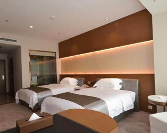 Aimu International Hotel - Zhengzhou - Habitación