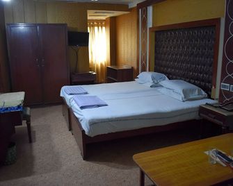 National Hotel - Lahore - Slaapkamer