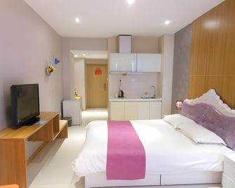 Xian Colors of the Rainbow Holiday Apartment - Xi'an - Sypialnia