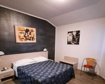 Hotel Rossi - דומניאנו - חדר שינה