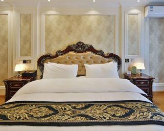 Jinzuo Apartment Hotel (Qingdao Chengyang Wanda Plaza) - Qingdao - Habitación