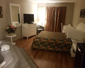 Motel les Pignons Verts - גטינו - חדר שינה