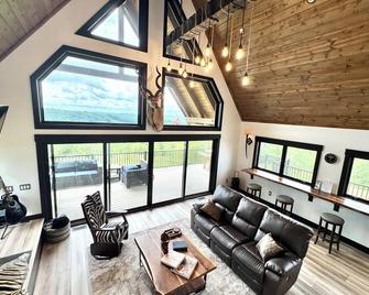 A unique modern farmhouse nestled on 67 rolling acres w/stunning views. - Coshocton - Living room