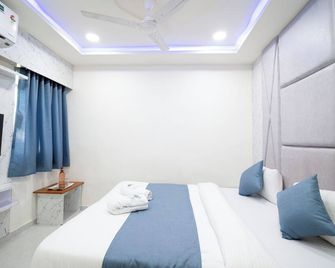 Hotel Nest Sky - Ahmedabad - Schlafzimmer