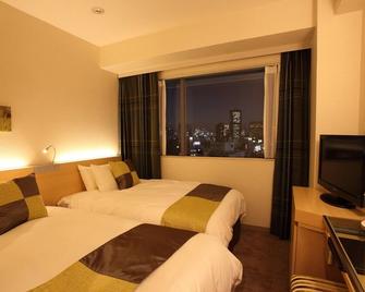 Hotel Keihan Kyobashi Grande - אוסקה - חדר שינה