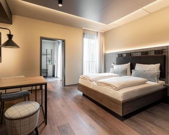 Freshsuites & Bar - Dachau - Bedroom