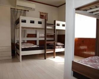 Guesthouse Unila - Shirakawa - Camera da letto