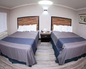 Diamond Bell Inn & Suites - Bell - Bedroom