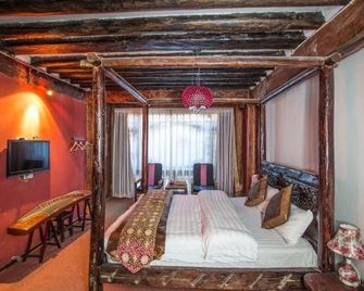 Shangri-La Eight Symbole Lotus Inn - Diqing - Bedroom