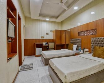 Hotel President, Pure Veg - Indore - Bedroom