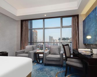 ووهان هويهاو هوتل - وهان - غرفة نوم