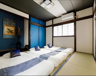Origami Inn Ten Gacha Ya - Ōsaka - Schlafzimmer
