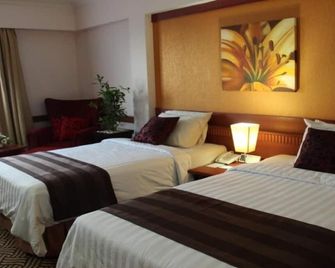 Abadi Suite Hotel & Tower - Jambi - Schlafzimmer