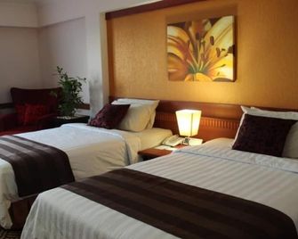 Abadi Suite Hotel and Tower by Tritama Hospitality - Jambi - Schlafzimmer