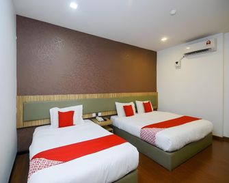 Super OYO 976 Dragon Inn - Miri - Bedroom