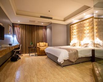 Yijia City Hotel (Mianyang Tieniu Square) - Mianyang - Habitación